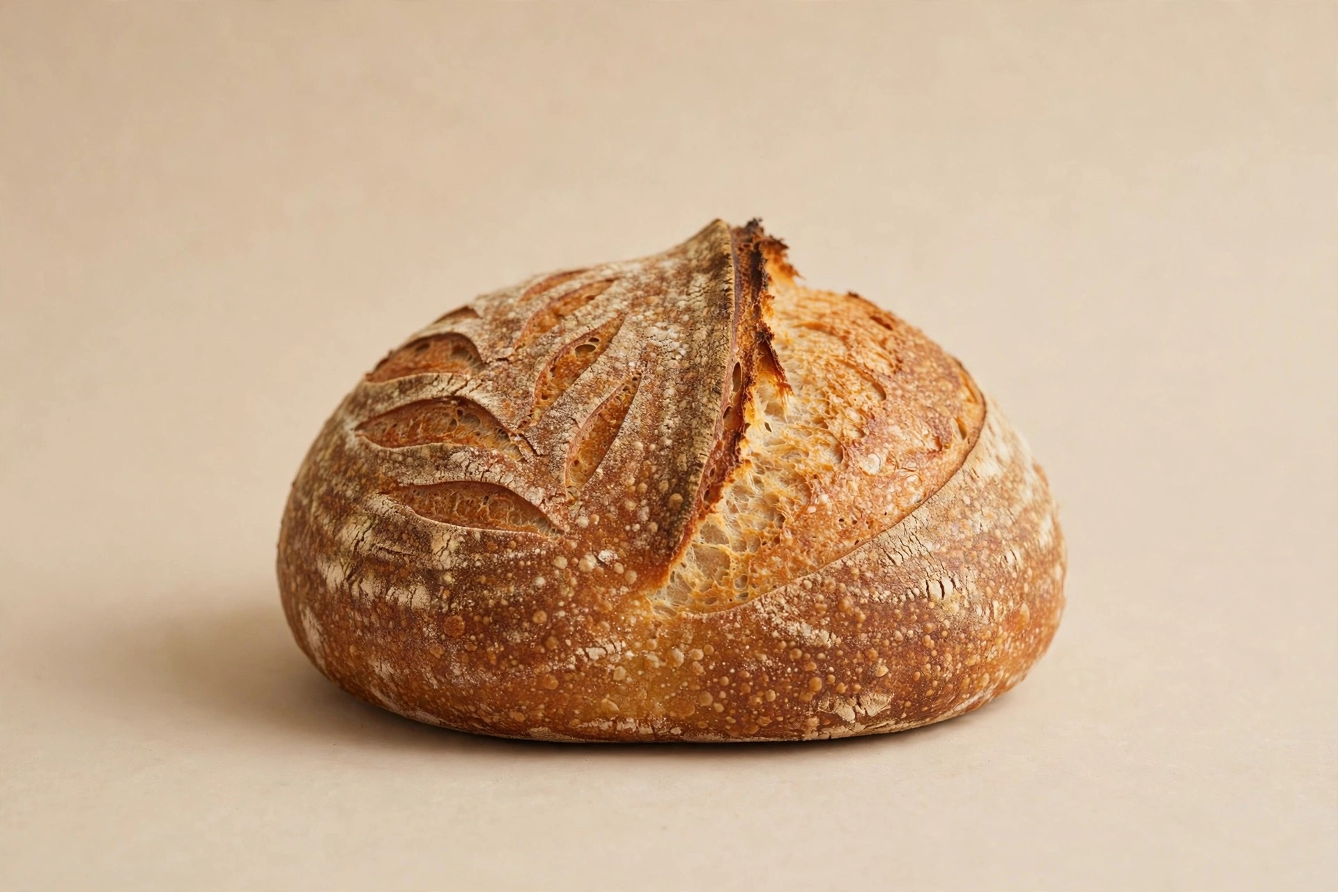 Golden sourdough loaf with a scored crust